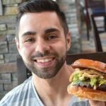 Joey Calcavecchia with a burger